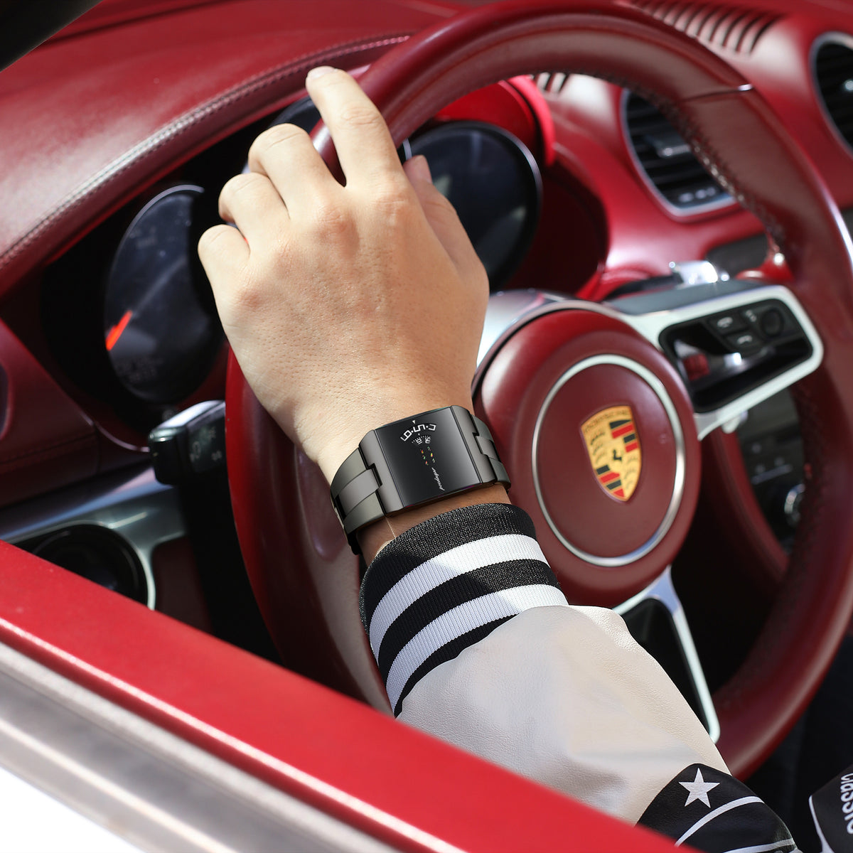 Ultra-thin quartz watch on wrist, black strap with dark face and blue digits