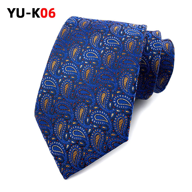 Blue paisley patterned tie on a white background with 'YU-K06' text.
