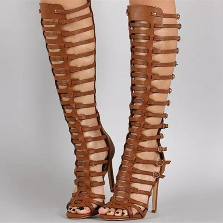 Brown knee-high gladiator stiletto sandals with cutout strap rows and open toe