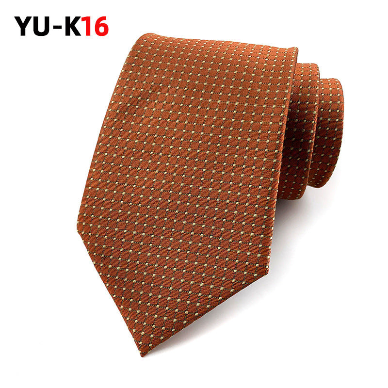 Brown patterned tie on a white background with 'YU-K16' text.