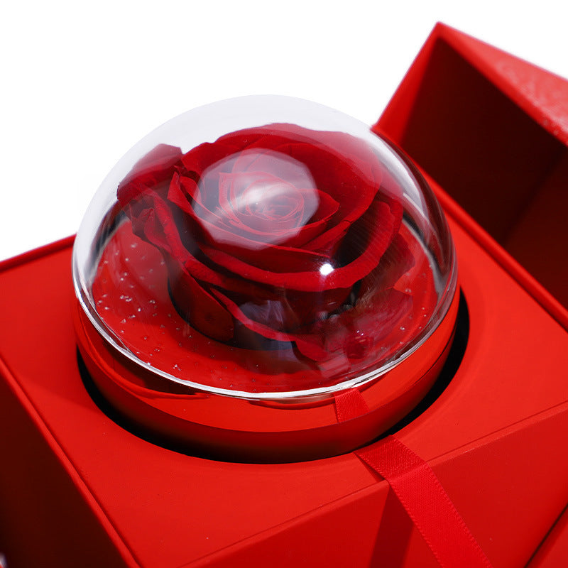 Red eternal rose centerpiece under clear glass dome inside red gift box