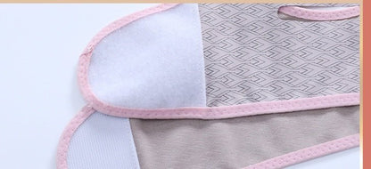 Close-up of the mask’s patterned fabric, pink edging, and overlapping fastening flap