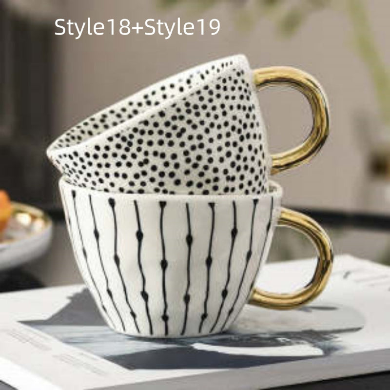 Ceramic mug with dotted speckle texture and vertical line pattern, gold handle
