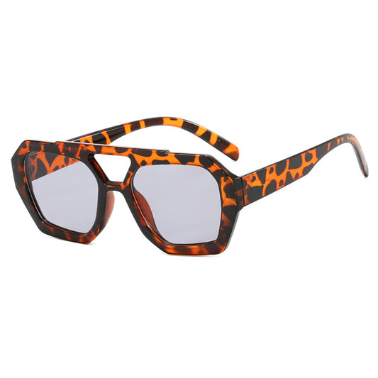 Sunglasses with a tortoiseshell frame on a white background