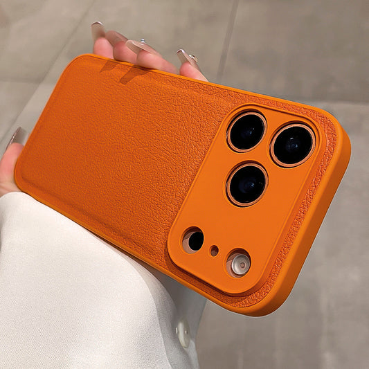 Orange phone case held by a person with a blurred background