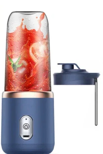 Portable 6-blade blender, dark blue base with clear blending cup and fruit contents