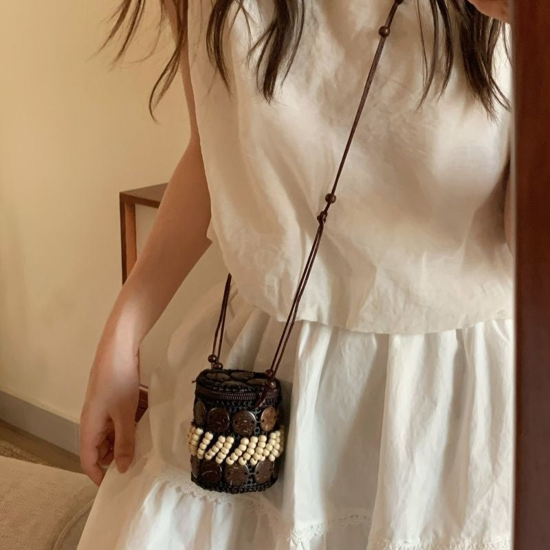 Handmade woven crossbody bag, dark brown round with white bead fringe and long strap
