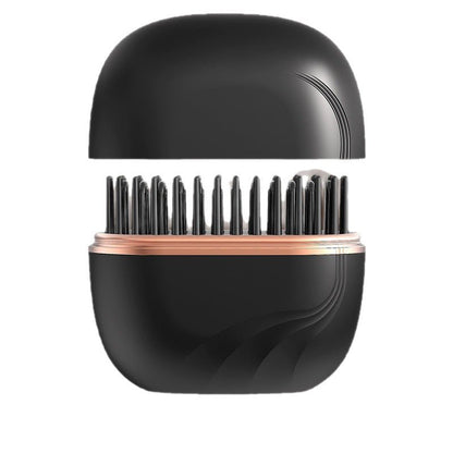 Mini cordless hair straightening comb with black body and heated metal teeth
