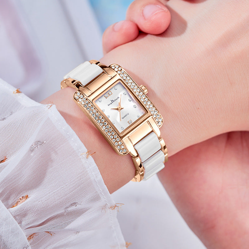 Rose gold square quartz wristwatch with rhinestone frame and white ceramic band