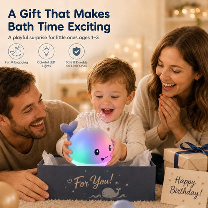 Whale fountain bath toy spraying water as a child holds it in a gift box