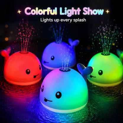 Whale fountain bath toys spraying water with red, blue, green, and multicolor lights