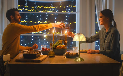 Cordless diamond table lamp with illuminated acrylic shade on a dining table