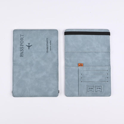 Light blue leather passport cover shown open, with card slots, SIM pockets, and an elastic band.