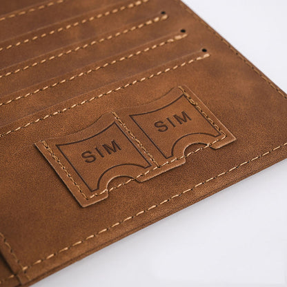 Brown leather passport cover detail with two SIM card pockets and stitched card slots.