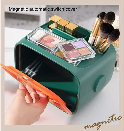 Retro TV tissue box with its orange magnetic front cover open and makeup stored on top.