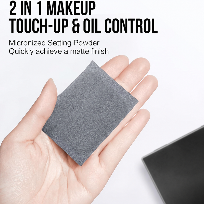 Dark gray square blotting sheet held in a hand