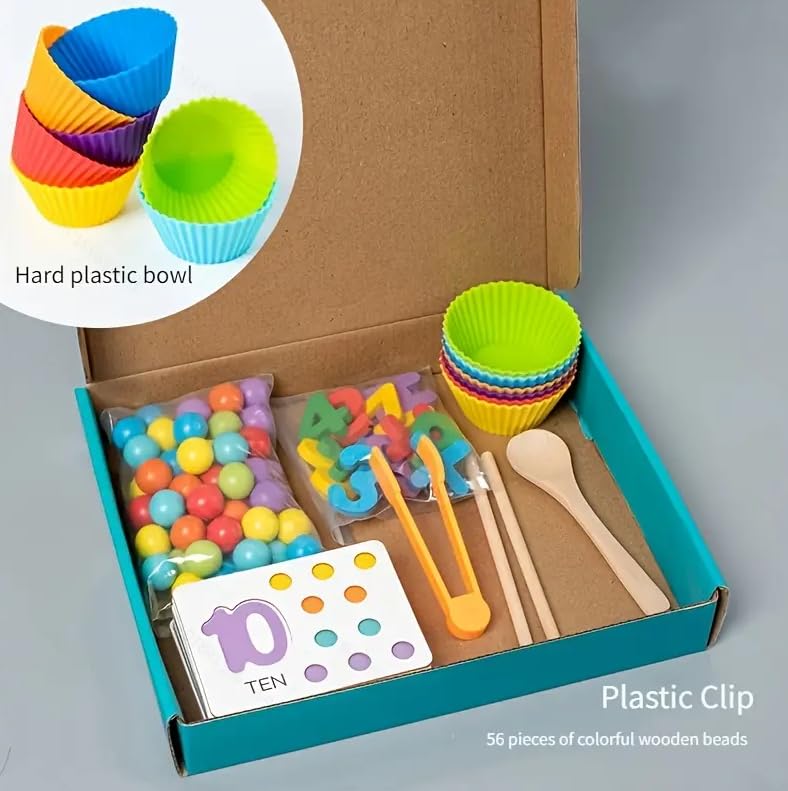Math learning set in an open box with counters, numbered cards, bowls and sorting tools