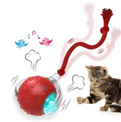 Red electric cat rolling ball toy with blue light and knotted red rope tail beside a cat