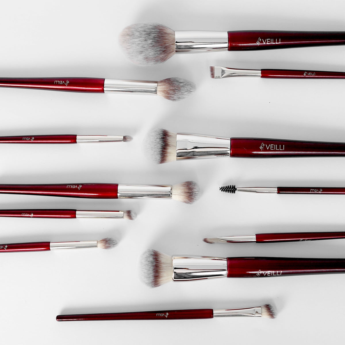 Makeup brush set showing assorted brush heads and a dual-ended brow comb