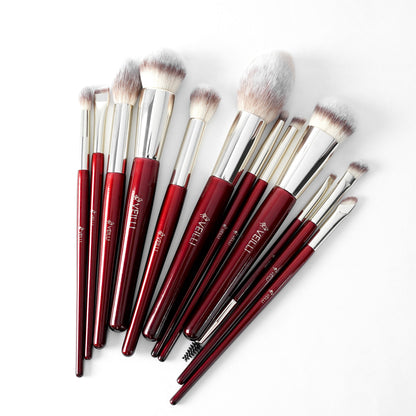 Twelve burgundy-handled makeup brushes with assorted fluffy and detail heads