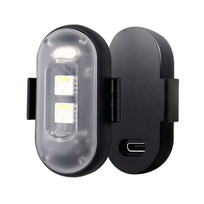Wireless LED strobe light with two LEDs, a clear cover, mounting clips, and a charging port