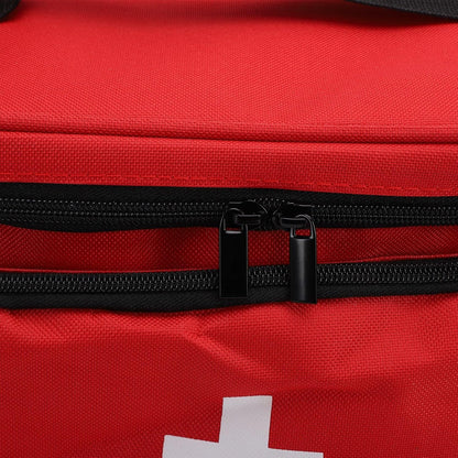 Close-up of the first aid bag's black zipper and white cross emblem