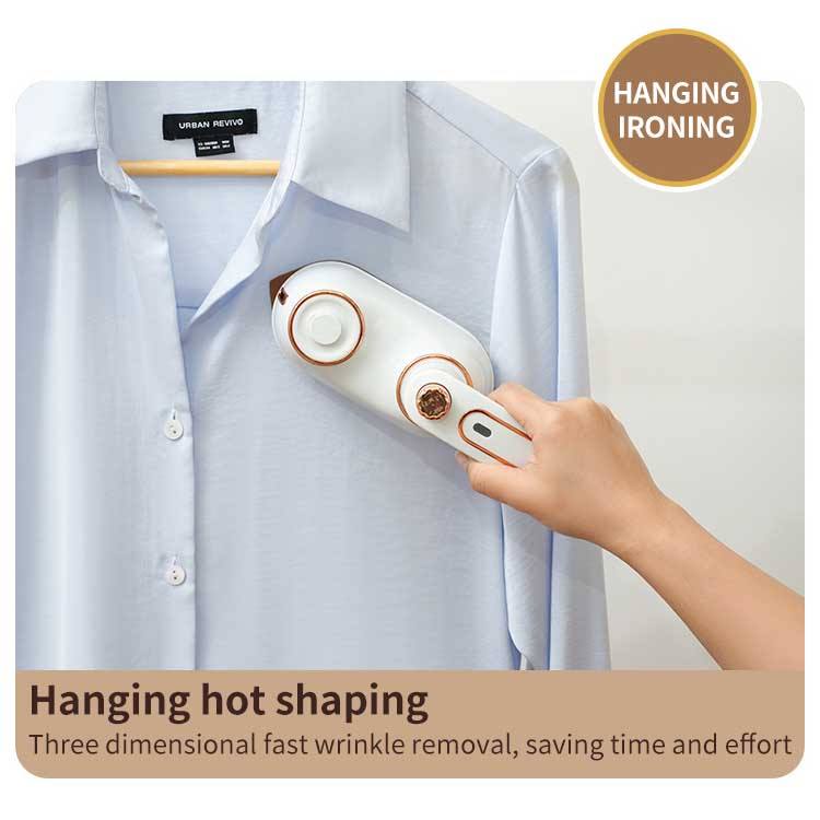 Portable folding clothes iron steaming a shirt on a hanger