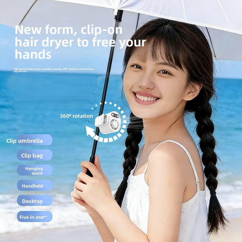 Small white clip-on fan attached to an umbrella pole