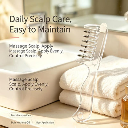 Clear scalp massage and liquid applicator comb with metal-tipped rollers and a long handle.