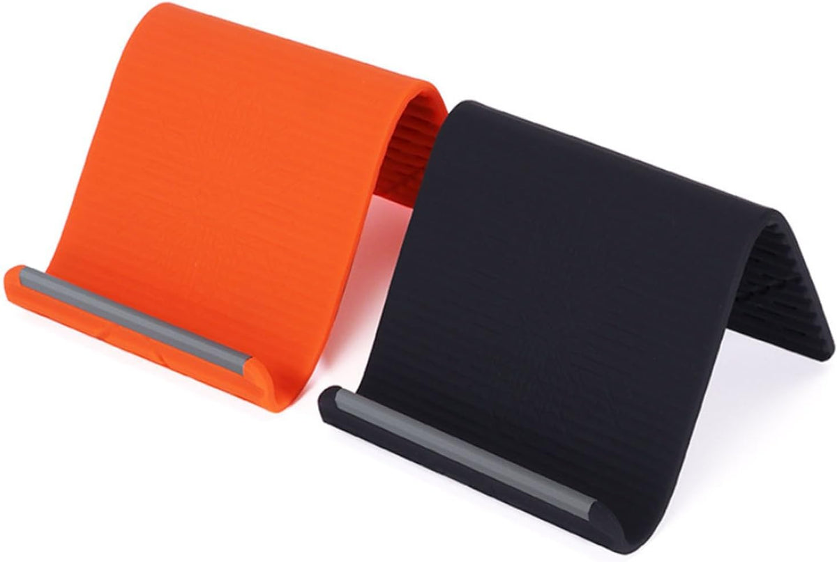 Foldable silicone phone stands in orange and black, each with a ribbed surface and support lip.