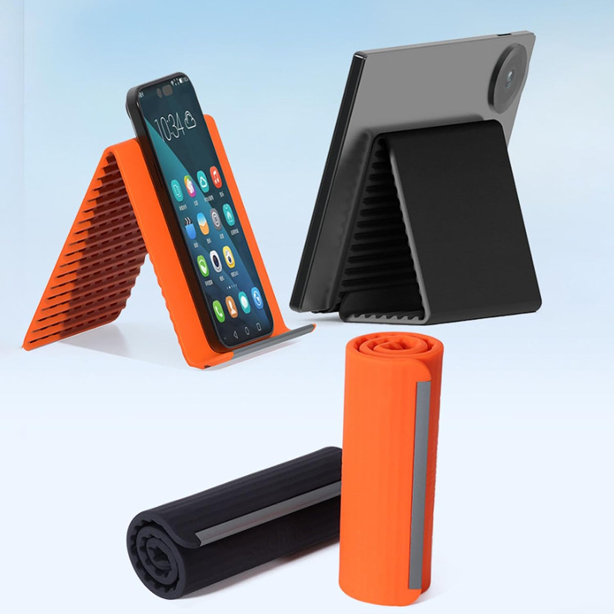 Foldable silicone phone stand shown holding phones and rolled for storage.