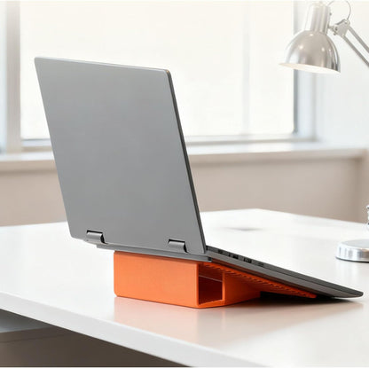 Orange silicone stand supports a laptop at an elevated angle.