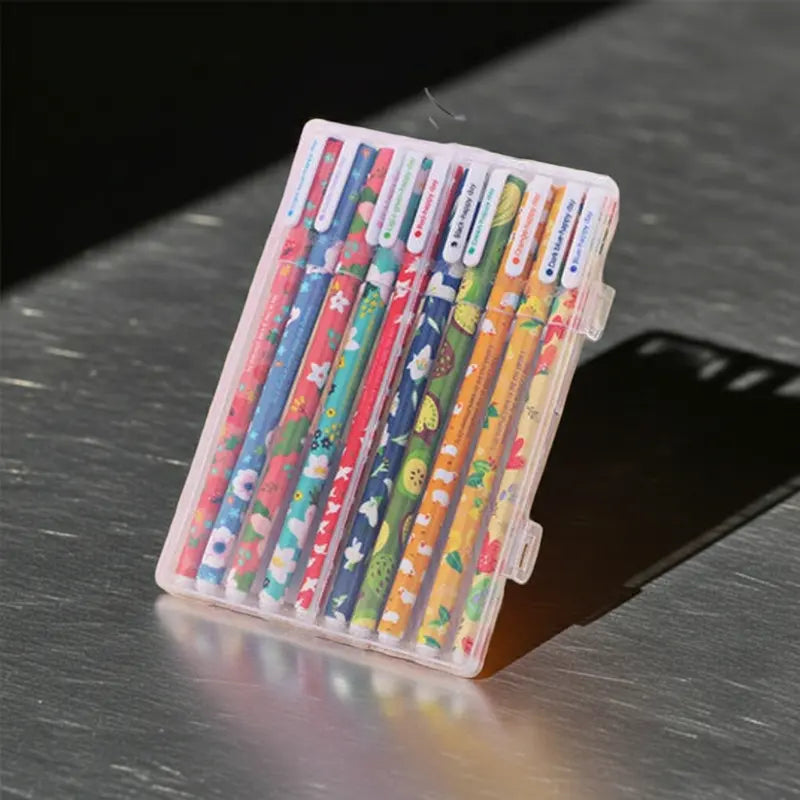Set of 10 colored gel pens in clear plastic case with patterned barrels