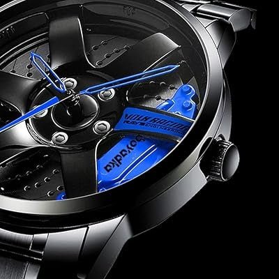 Close-up of a black wristwatch dial with blue hands and caliper detail