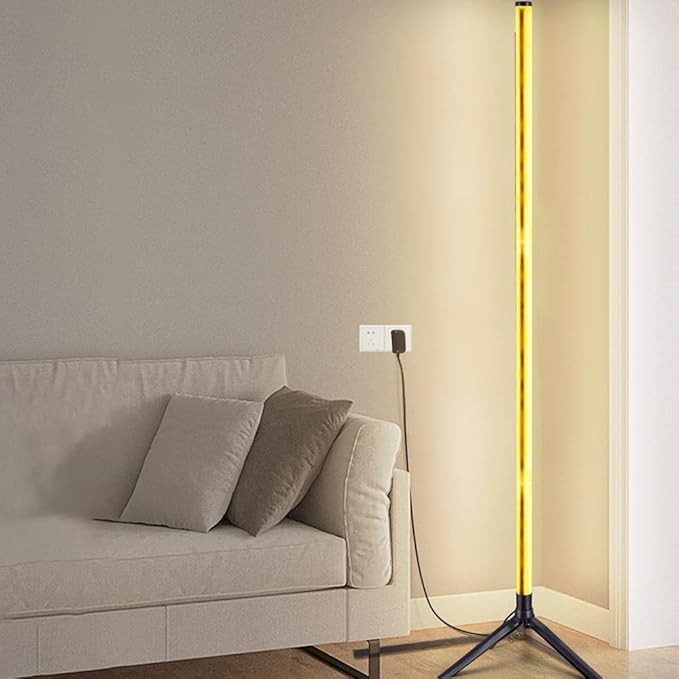 Slim LED floor lamp with a warm yellow light bar and three-legged base.