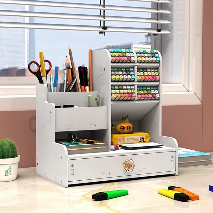 White desktop organizer from the side, with marker racks, pencil cups, shelves, and closed drawer