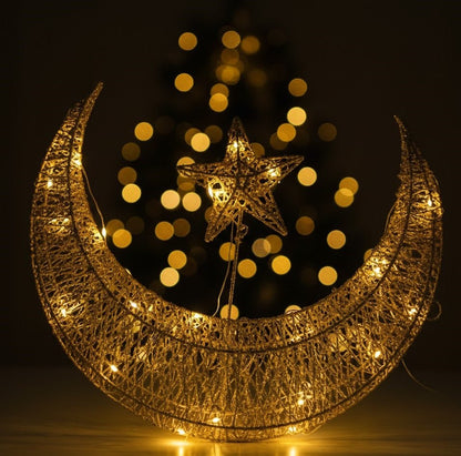 Gold crescent moon and star ornament with intricate openwork and small lights