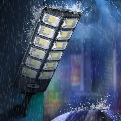 Solar sensor outdoor light with two rows of LED panels, shown in rain.