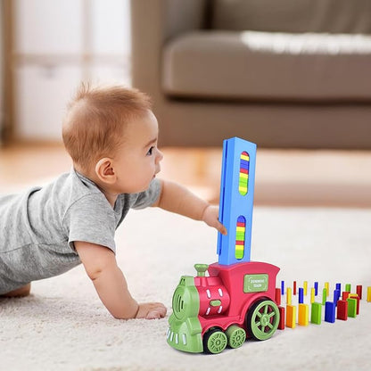 Automatic domino train set with a red and green locomotive, blue loading tower, and colorful dominoes