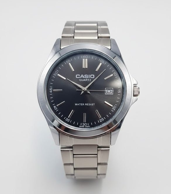 Casio men's watch with dark dial, date display, silver-tone case, and metal link bracelet