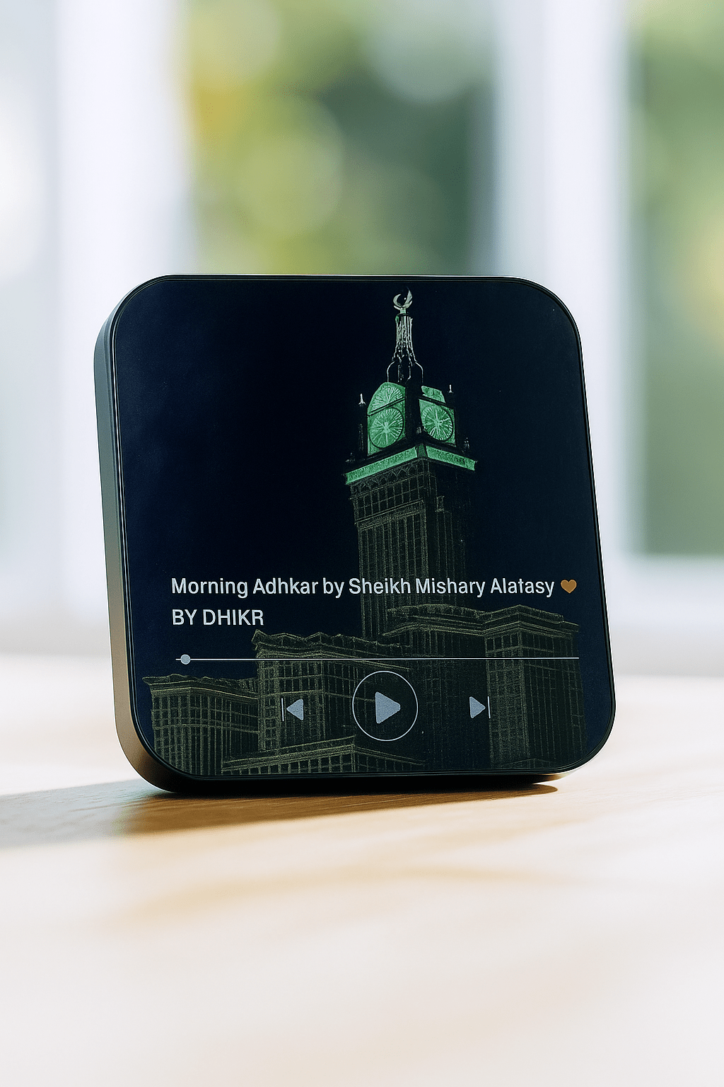 Islamic LED audio speaker showing Makkah clock tower artwork and playback controls