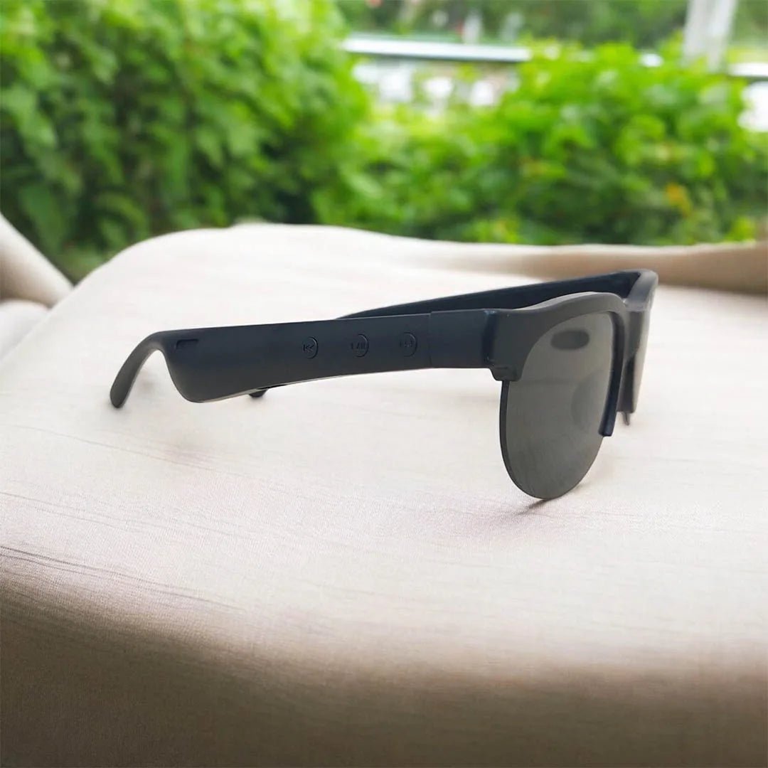 Side view of black headset glasses with dark lenses and control buttons on the temple.
