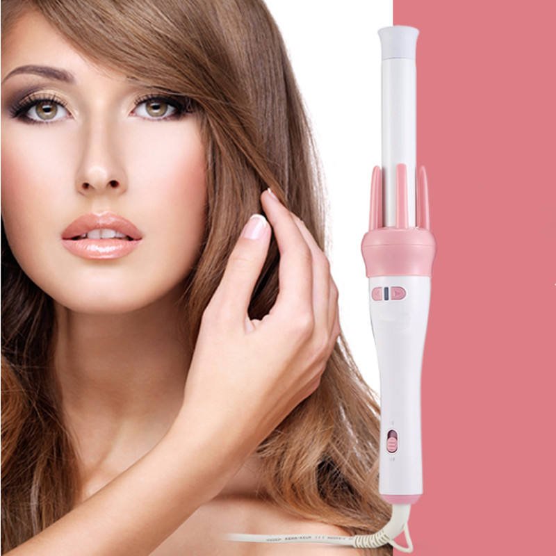 White and pink hair curler shown beside a woman touching her hair