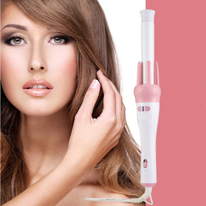White and pink hair curler shown beside a woman touching her hair
