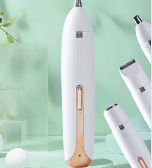 White 4-in-1 hair trimmer with rose gold control panel and interchangeable grooming heads