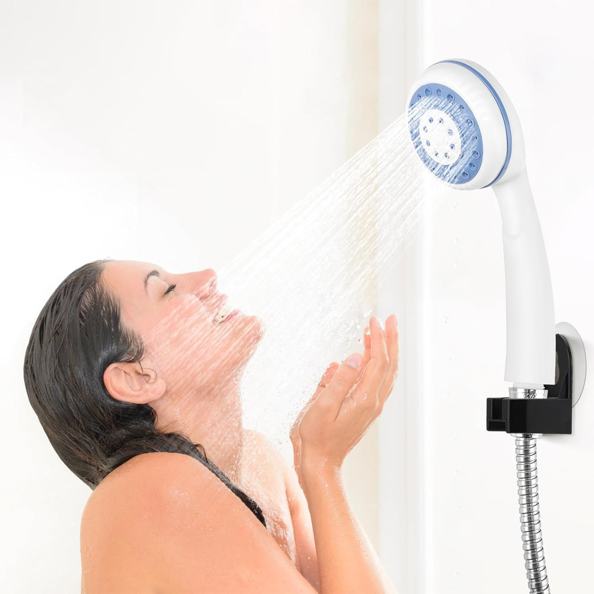 White handheld shower with blue spray face and flexible metal hose, mounted on a bracket