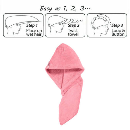 Pink hair drying cap towel shown in a twisted shape with a button fastening loop.