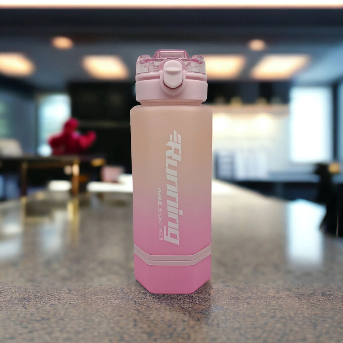 Pink running water bottle with clear flip-top lid and locking clasp
