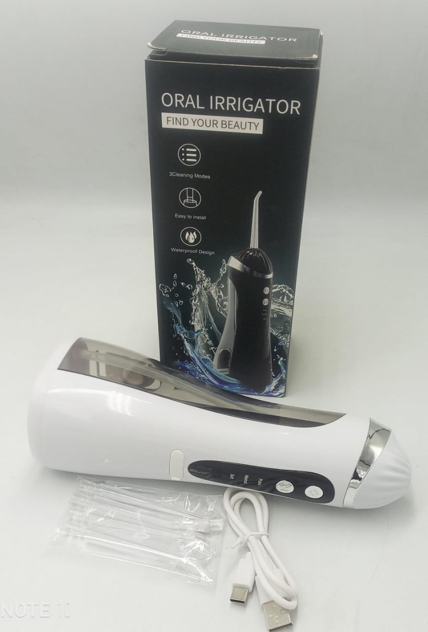 Oral irrigator with white-and-gray handheld unit, water flosser tips, USB cable, and retail box