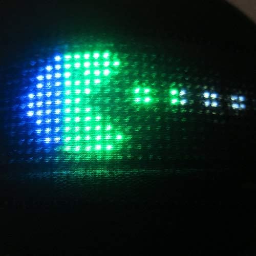 Close-up of the cap's glowing blue, green, and white LED display
